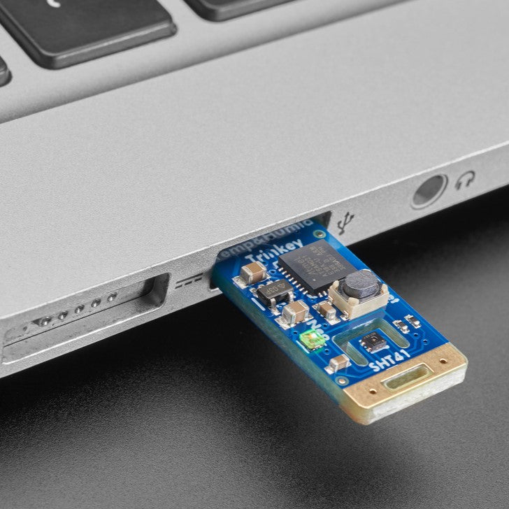 Adafruit SHT41 Trinkey - USB Temperature and Humidity Sensor - It's half USB Key, half temperature-humidity sensor... it's the Adafruit SHT41 Trinkey. We wanted to make it super-easy to add one of our most popular combination environmental sensors to any computer with a USB A port.