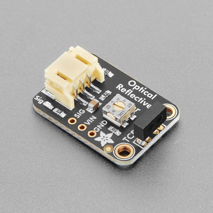 Adafruit STEMMA Reflective Photo Interrupt Sensor - TCRT1000 - An optical reflective sensor is a composite electronic device with two elements - an IR LED and an IR photo-transistor. The IR LED blasts light, and when something bounces the light back to the photo-transistor, the transistor turns on and the amount of current flowing through it increases.