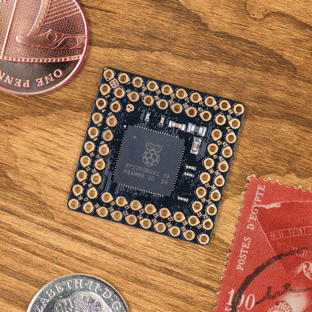PGA2350 - A minimal but powerful RP2350 breakout board modelled on a Pin Grid Array, with the maximum exposed pins crammed into the smallest possible space.