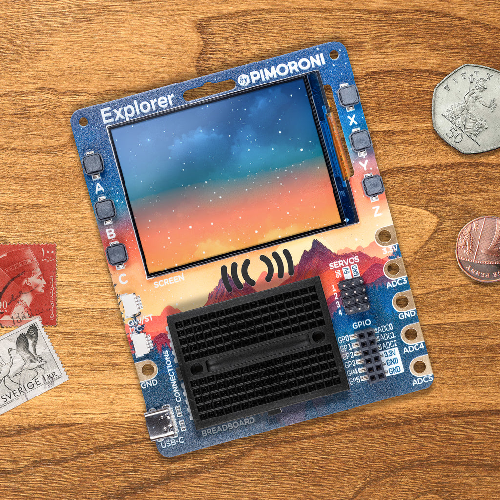 Pimoroni Explorer - An electronic adventure playground for physical computing, built around the RP2350 chip. Includes a 2.8" LCD screen, a speaker, a mini breadboard, and much more!