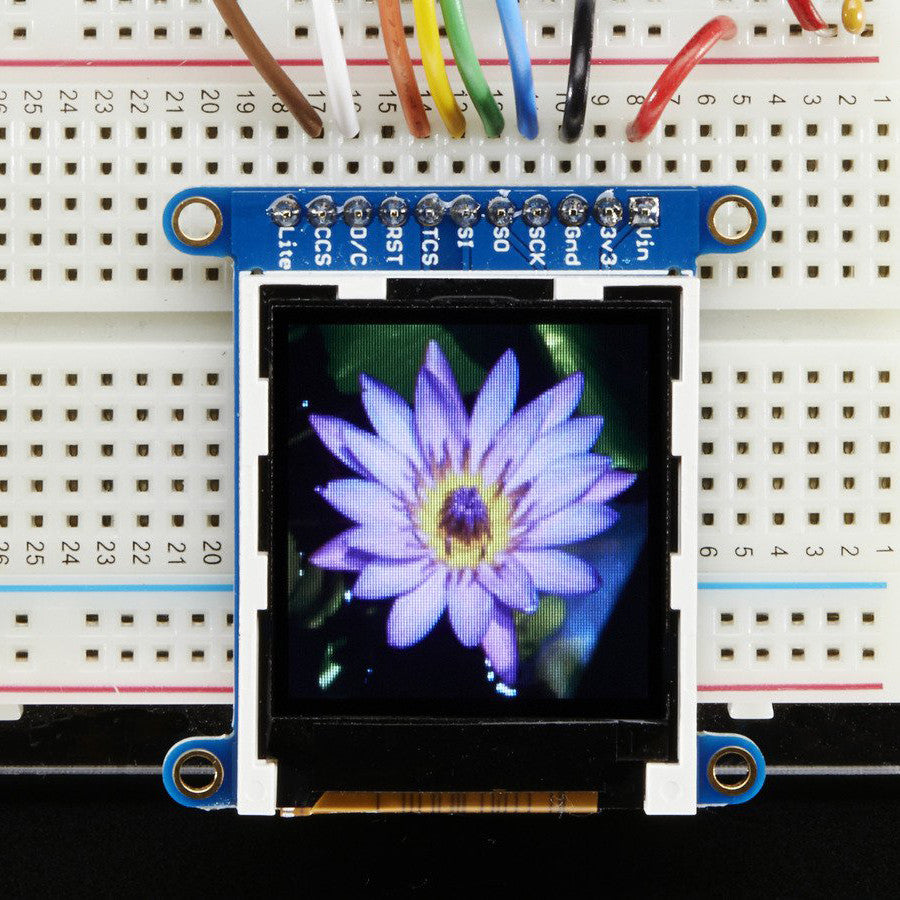 Adafruit 1.44" Color TFT LCD Display with MicroSD Card breakout - ST7735R - This lovely little display breakout is the best way to add a small, colorful and bright display to any project. Since the display uses 4-wire SPI to communicate and has its own pixel-addressable frame buffer, it can be used with every kind of microcontroller. Even a very small one with low memory and few pins available!