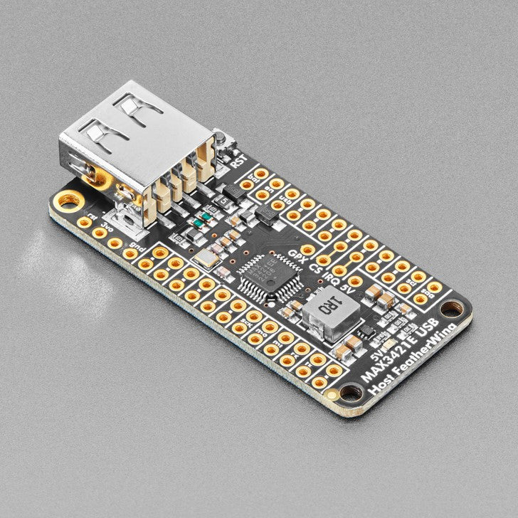 Adafruit USB Host FeatherWing with MAX3421E - Lots of microcontrollers these days have USB ports on them, to program or debug, act like a keyboard or disk drive, or simply send data between a computer and your firmware. But did you know that you can also add a USB Host port?