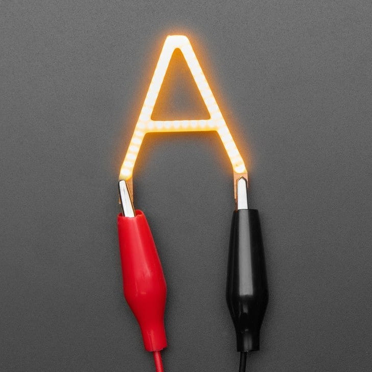 Alphabet LED Filament - This warm-white glowy letter is made out of COB (chip on board) LEDs, often seen in 'Edison-like' LED bulbs, arranged in different patterns to give a bright, warm lighting effect.