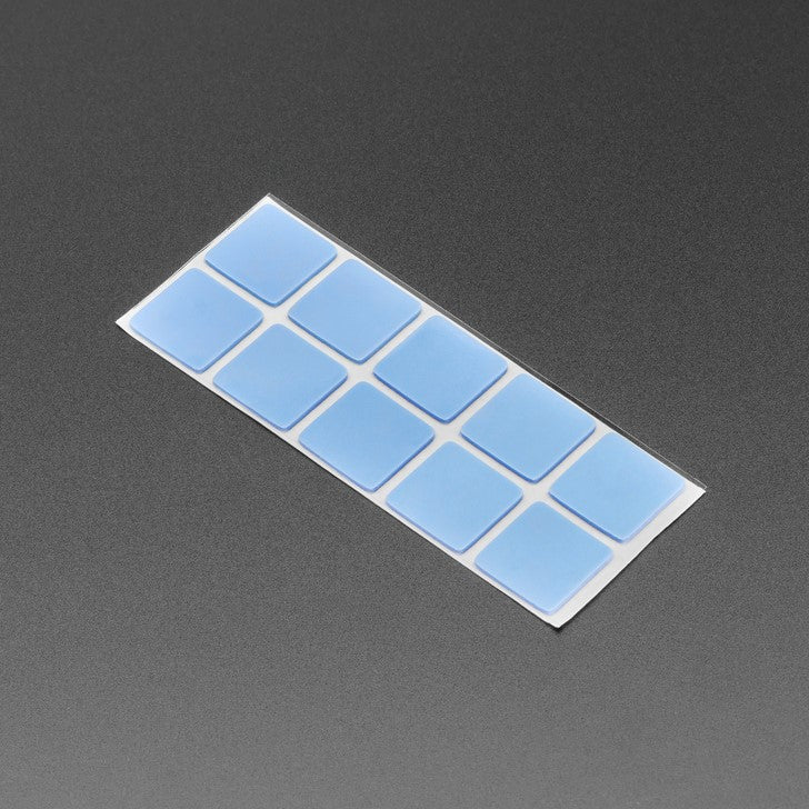 Heat Sink Thermal Sticker Tabs - 10 Pack - Perfect for a variety of small projects, these adhesive squares provide a strong bond to most surfaces and are an excellent way to attach heat sinks to a chip.