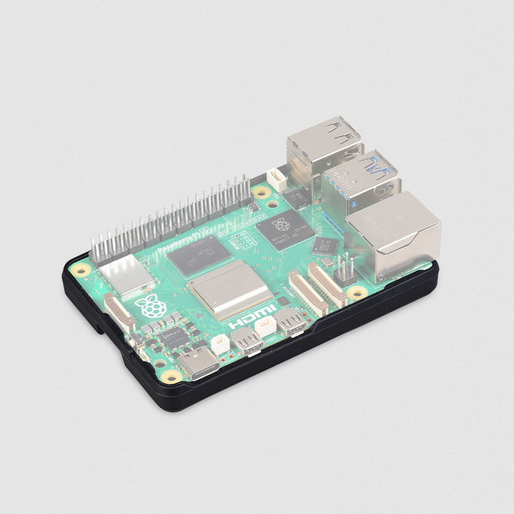 Raspberry Pi 5 Bumper Case - The Raspberry Pi Bumper is a minimal snap-on silicone case that protects the bottom and edges of a Raspberry Pi 5, while allowing easy access to the power button and mounting holes.