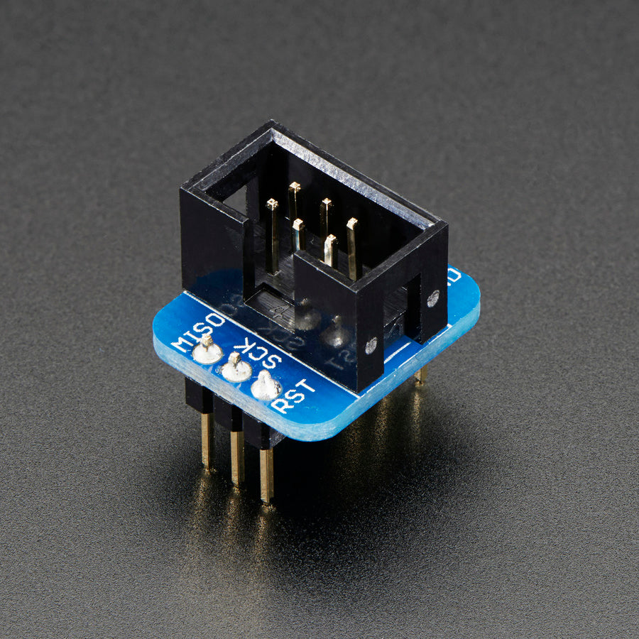 Adafruit 6-pin AVR ISP Breadboard Adapter Mini Kit - A simple breakout, 2x3 box header in the center, two 1x3's on the side. Plugs into any breadboard for neat wiring (in both nifty and clean senses of the word).