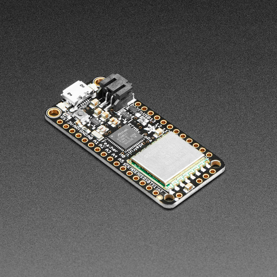 Adafruit Feather M0 with RFM95 LoRa Radio - 900MHz - RadioFruit - This is the Adafruit Feather M0 RFM95 LoRa Radio (900MHz). We call these RadioFruits, Adafruit's take on an microcontroller with a "Long Range (LoRa)" packet radio transceiver with built in USB and battery charging.