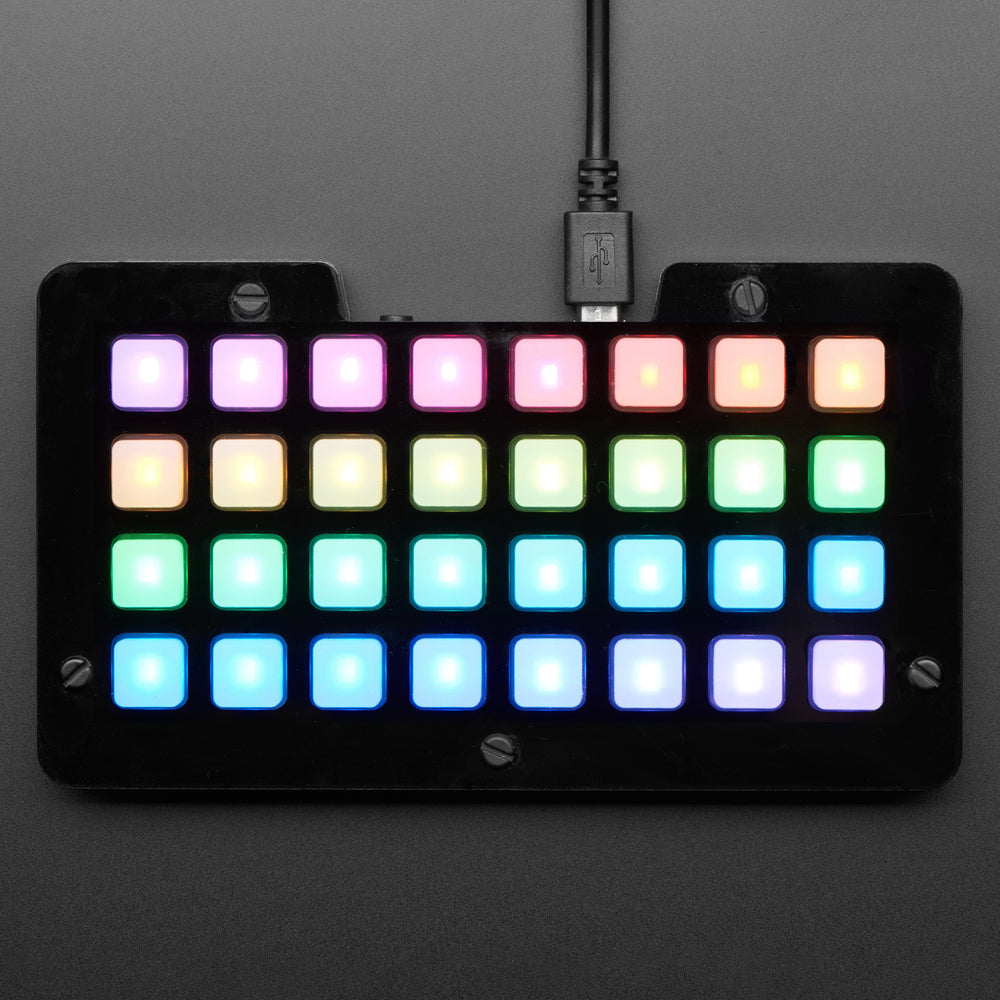 Adafruit NeoTrellis M4 with Enclosure and Buttons Kit Pack - So you've got a cool/witty name for your band, a Soundcloud account, a 3D-printed Daft Punk helmet... so what could be missing from your road to stardom? The NeoTrellis M4 Kit Pack, of course!