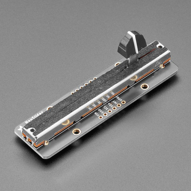 Adafruit NeoSlider I2C QT Slide Potentiometer with 4 NeoPixels - Our family of I2C-friendly user interface elements grows by one with this new product that makes it plug-n-play-easy to add a 75mm long slide potentiometer to any microcontroller or microcomputer with an I2C port.